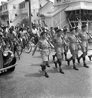 British soldiers marching in Georgetown, British Guiana watched by local citizens British soldiers marching in Georgetown, British Guiana watched by local citizens