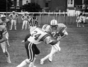 British Steel Gala - A member of the Scunthorpe Steelers tries to dodge a tackle by an British Steel Gala - A member of the Scunthorpe Steelers tries to dodge a tackle by an