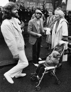 Brothers Barry and Maurice Gibbn of the Bee Gees pop group meet up with neighbours they Brothers Barry and Maurice Gibbn of the Bee Gees pop group meet up with neighbours they
