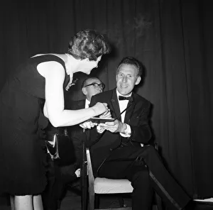 Bruce Forsyth signing an autograph at the Daily Mirror Television Award show Bruce Forsyth signing an autograph at the Daily Mirror Television Award show
