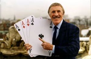 Bruce Forsyth TV Presenter Holding playing cards which are used on his hit tv show Play Bruce Forsyth TV Presenter Holding playing cards which are used on his hit tv show Play