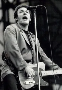 Bruce Springsteen performing on stage during a concert at Villa Park Bruce Springsteen performing on stage during a concert at Villa Park