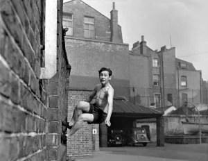 A Cadet at the London Nautical School, Broadwall, London seen here running along the side A Cadet at the London Nautical School, Broadwall, London seen here running along the side