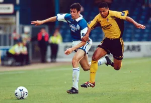 Cardiff's Mark Delaney beats Fulham's John Salako to the ball Cardiff's Mark Delaney beats Fulham's John Salako to the ball