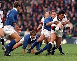 Will Carling is tackled as he tries to break the Italian defence during the England v Will Carling is tackled as he tries to break the Italian defence during the England v