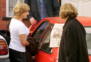 Caroline Aherne who plays television characture Mrs Merton is shown a copy of the Daily Caroline Aherne who plays television characture Mrs Merton is shown a copy of the Daily