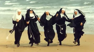 The cast of Nunsense at the Phoenix Theatre in Blyth mess about on the beach before The cast of Nunsense at the Phoenix Theatre in Blyth mess about on the beach before