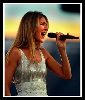 Celine Dion at Murrayfield Edinburgh July 1999 Silver dress singing into microphone Celine Dion at Murrayfield Edinburgh July 1999 Silver dress singing into microphone