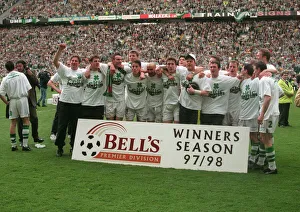 Celtic players celebrate winning the league championship 1998 with cup trophy winners Celtic players celebrate winning the league championship 1998 with cup trophy winners