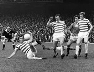 Celtic v. Rangers Bobby Murdoch clears for Celtic as Colin Stein lies injured in Celtic v. Rangers Bobby Murdoch clears for Celtic as Colin Stein lies injured in