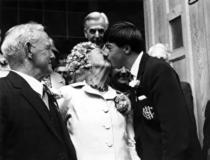 After the ceremony, 78-year-old bridegroom Herbert Clear watches as Philip Ealey gives After the ceremony, 78-year-old bridegroom Herbert Clear watches as Philip Ealey gives