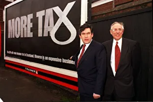 Chancellor Gordon Brown March 1999 with Donald Dewar pointing at poster about SNP Chancellor Gordon Brown March 1999 with Donald Dewar pointing at poster about SNP
