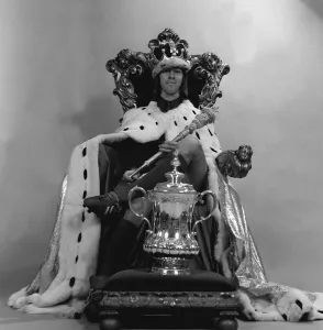 Charlie George sits on the throne as king with FA cup 1972 Charlie George sits on the throne as king with FA cup 1972
