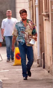 Charlie Sheen actor filming July 1997, at Clydebank Town Hall near Glasgow with cup of Charlie Sheen actor filming July 1997, at Clydebank Town Hall near Glasgow with cup of