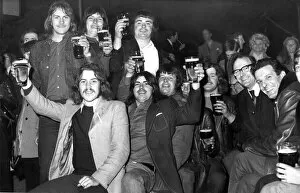 Images Dated 1st May 1973: Cheers, Lads! It may be cold, it may be raining outside but these festival goers seem