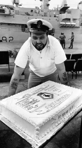 Chef, Petty Officer Bill Colmer with the cake made to commemorate HMS Liverpool' Chef, Petty Officer Bill Colmer with the cake made to commemorate HMS Liverpool'
