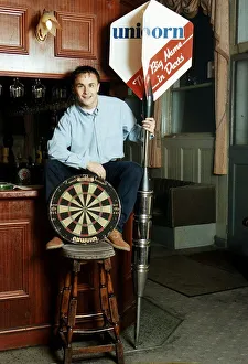Chelsea and England footballer Dennis Wise poses in a public house with a dartboard Chelsea and England footballer Dennis Wise poses in a public house with a dartboard