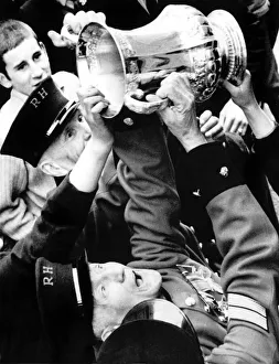 Chelsea Pensioners get a hand on the FA Cup as Dave Webb hands it to them during Chelsea Pensioners get a hand on the FA Cup as Dave Webb hands it to them during