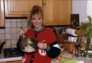 Cheryl Baker former Bucks Fizz singer and TV presenter cooking a stir fry in her kitchen Cheryl Baker former Bucks Fizz singer and TV presenter cooking a stir fry in her kitchen