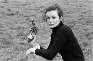 Chief Instructor, Sergeant Ivor Montgomery, training police women on the firing range at Chief Instructor, Sergeant Ivor Montgomery, training police women on the firing range at