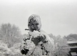 Child playing in the snow after a heavy fall at Hampstead Heath January 1945 Child playing in the snow after a heavy fall at Hampstead Heath January 1945