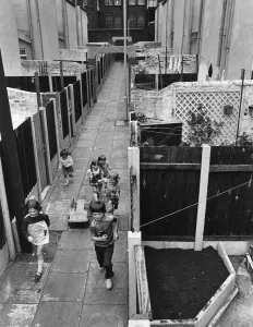 Children playing in alleyways of Liverpool's Flower Streets, Kirkdale, Liverpool Children playing in alleyways of Liverpool's Flower Streets, Kirkdale, Liverpool