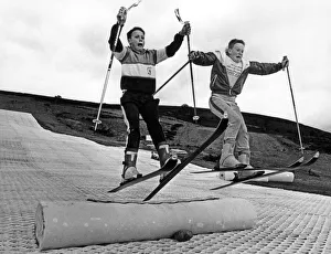 Children practising their ski-jumps on their self made jumps while the permanent jumps Children practising their ski-jumps on their self made jumps while the permanent jumps