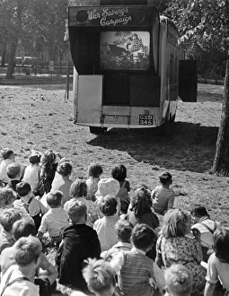 Children watch an open air cinema performance of Ralph Reader's 'Gang Show" Children watch an open air cinema performance of Ralph Reader's 'Gang Show"