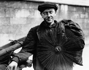 Chimney sweep in London with with brush and rods, May 1937 Chimney sweep in London with with brush and rods, May 1937