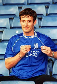 Chris Sutton, poses for the media during a photocall at Stamford Bridge after signing a Chris Sutton, poses for the media during a photocall at Stamford Bridge after signing a