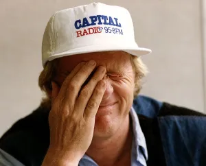 Chris Tarrant radio and TV presenter wearing one of his two hats during interview Chris Tarrant radio and TV presenter wearing one of his two hats during interview
