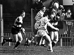 Chris Webber of Cardiff passes over the head of Cambridge's Andy Sutton Chris Webber of Cardiff passes over the head of Cambridge's Andy Sutton