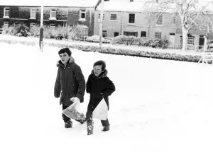 Christian Clapton (left) and Paul Isbel (right) trudge through the thick snow to get to Christian Clapton (left) and Paul Isbel (right) trudge through the thick snow to get to