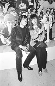 Christine Shrimpton with David Bailey. sitting in front of Photographic montage Christine Shrimpton with David Bailey. sitting in front of Photographic montage