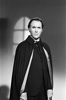 Christopher Lee, being photographed for poster, dressed as character Dracula in film Christopher Lee, being photographed for poster, dressed as character Dracula in film
