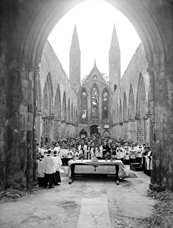 A church service in the bombed out remains of Norwich Cathedral A church service in the bombed out remains of Norwich Cathedral