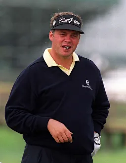 The cigar-smoking Darren Clarke of England at the 128th Golf Open at Carnoustie, Scotland The cigar-smoking Darren Clarke of England at the 128th Golf Open at Carnoustie, Scotland