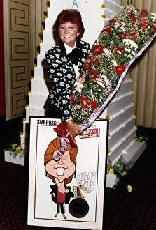 Images Dated 26th September 1988: Cilla Black TV celebrates 25 years in show business with a huge cake given to her by