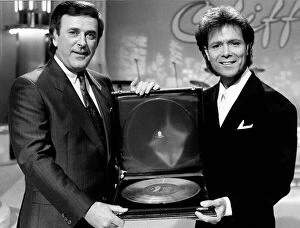 Images Dated 16th November 1988: Cliff Richard Singer actor with Terry Wogan receiving award. November 1988