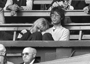 Cliff Richard with Sue Barker leaning on his arm watching Wimbledon tennis - June 1982 Cliff Richard with Sue Barker leaning on his arm watching Wimbledon tennis - June 1982