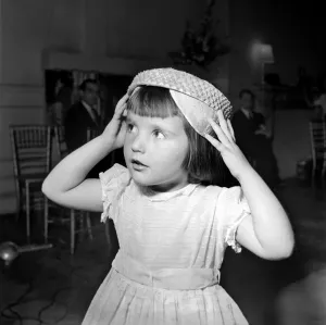 Clothing Hat Fashion: Child wearing a hat. July 1953 D3883 Clothing Hat Fashion: Child wearing a hat. July 1953 D3883