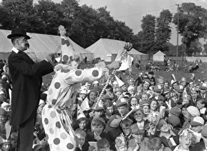 Clowns seen here performing at the Twickenham Garden Fete. Circa 1930 Clowns seen here performing at the Twickenham Garden Fete. Circa 1930