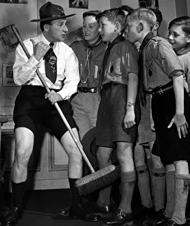 Comedian Charlie Chester wearing a Scouts uniform with as he talks with Boys Scouts Comedian Charlie Chester wearing a Scouts uniform with as he talks with Boys Scouts