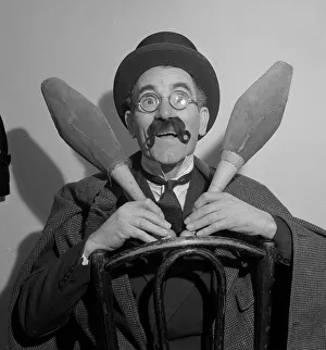 Comedian Eddie Gray seen here holding skittles wearing a false moustache Comic Comedian Eddie Gray seen here holding skittles wearing a false moustache Comic
