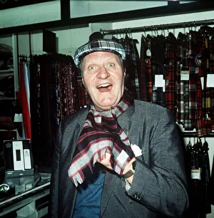 Comedian Tommy Cooper in a tartan shop 1974 Comedian Tommy Cooper in a tartan shop 1974