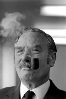 A competitior in the British National Pipe Smoking Championship puffing on his pipe A competitior in the British National Pipe Smoking Championship puffing on his pipe