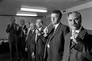 Competitiors in the British National Pipe Smoking Championship puffing on their pipes Competitiors in the British National Pipe Smoking Championship puffing on their pipes