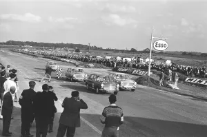 Competitors take the checkered flag in the Molyslip Morris 1100 race at Snetterton race Competitors take the checkered flag in the Molyslip Morris 1100 race at Snetterton race