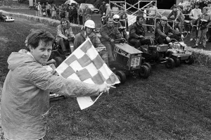 Competitors for the great Lawn Mower Grand Prix line-up on the ' Competitors for the great Lawn Mower Grand Prix line-up on the '