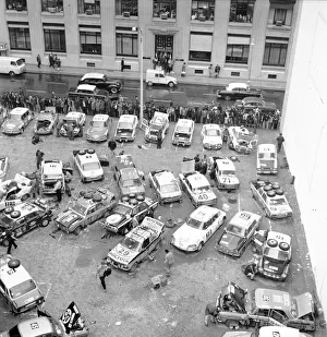 Competitors prepare their cars for the next stage of the Daily Mirror World Cup Rally Competitors prepare their cars for the next stage of the Daily Mirror World Cup Rally
